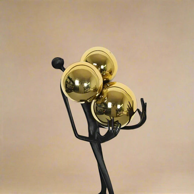 The Balancing Act Statue - Palatium Lux